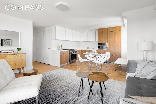 living room with light hardwood / wood-style floors