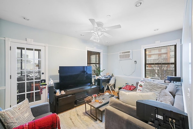 living area with ceiling fan, a wall mounted AC, wood finished floors, and recessed lighting