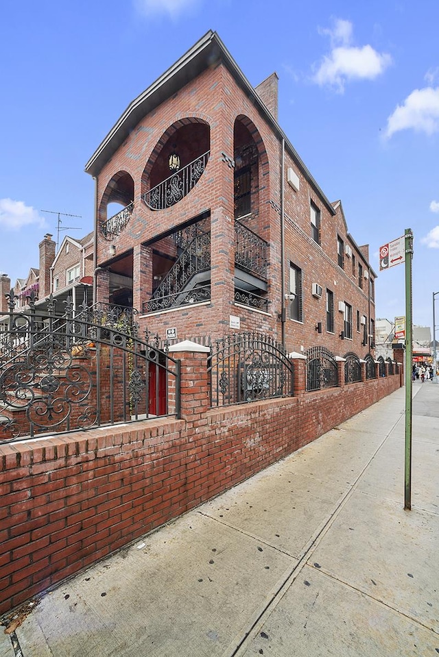 view of building exterior with a fenced front yard