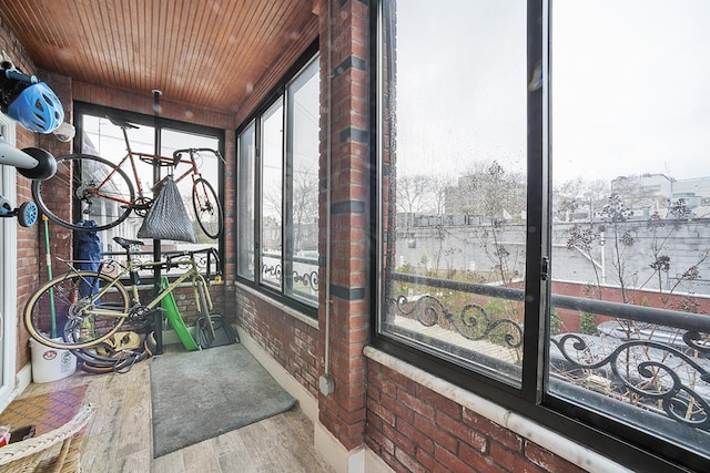 sunroom / solarium featuring wooden ceiling and a wealth of natural light