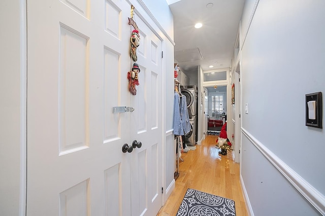 hallway with light wood-type flooring and recessed lighting