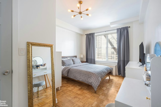 bedroom with a chandelier