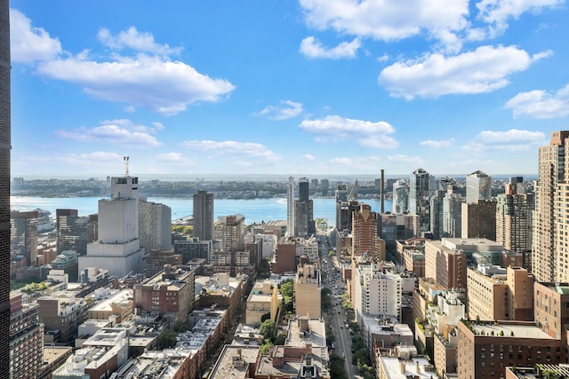 property's view of city featuring a water view