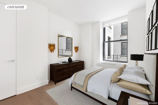 bedroom with light hardwood / wood-style floors