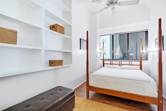 bedroom featuring hardwood / wood-style flooring and ceiling fan