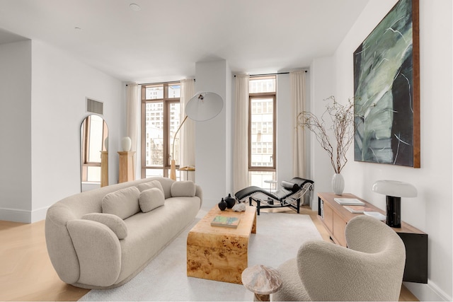 living room with visible vents and baseboards