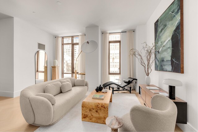 215 E 19th St Unit 6F, New York City, NY 10003 - living room featuring plenty of natural light