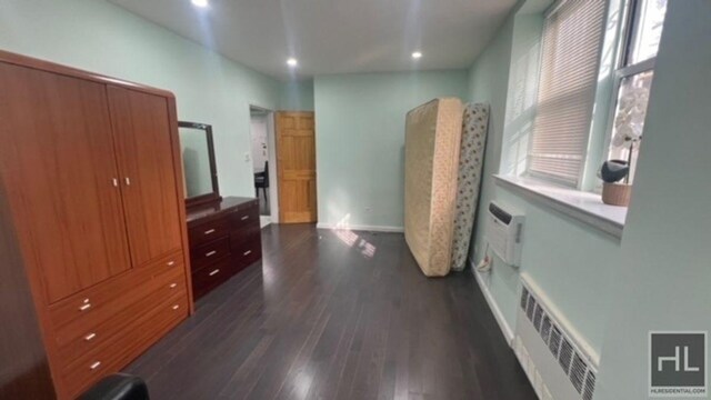 bedroom with visible vents, recessed lighting, and dark wood-type flooring