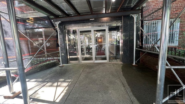 entrance to property with brick siding