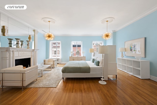 bedroom with hardwood / wood-style flooring and ornamental molding