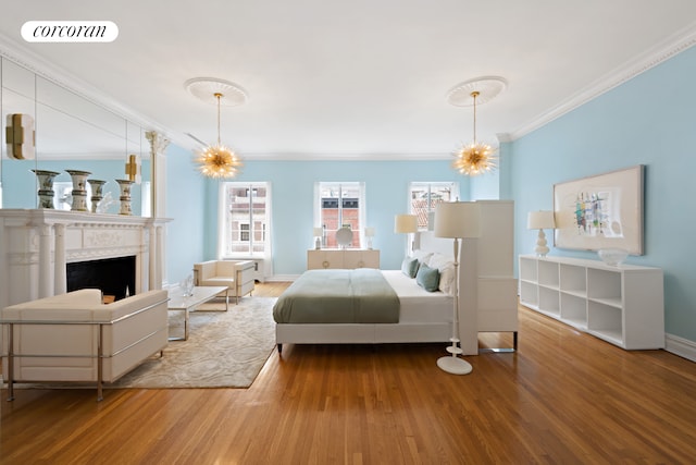 7 E 63rd St, New York City, NY 10065 - bedroom with visible vents, baseboards, ornamental molding, a fireplace, and wood finished floors