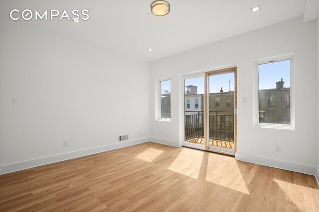 bathroom featuring hardwood / wood-style floors, sink, tile walls, and toilet