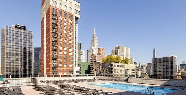 view of swimming pool with a patio area