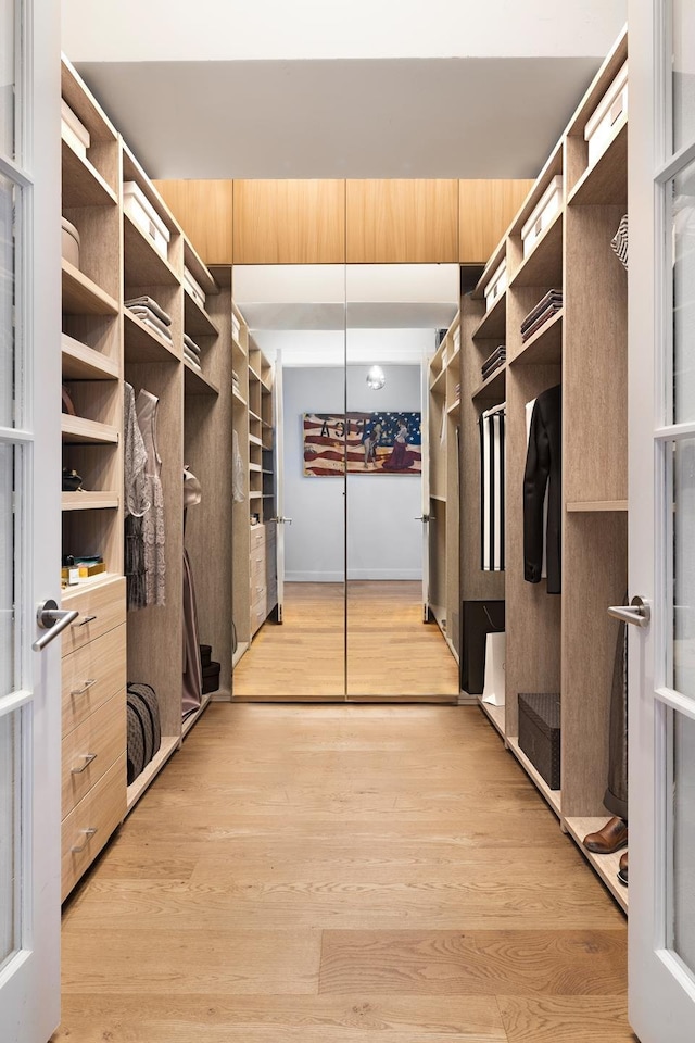 walk in closet featuring light wood-style floors