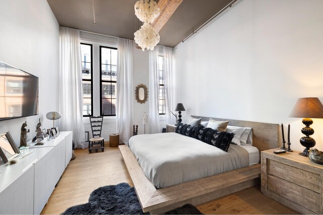 bedroom with light wood-type flooring