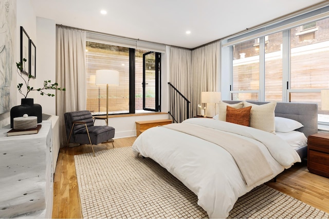 bedroom featuring light wood-style floors and recessed lighting