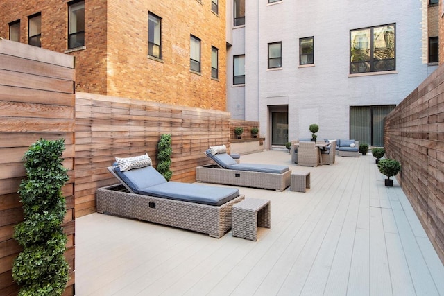 view of patio featuring outdoor lounge area and a wooden deck