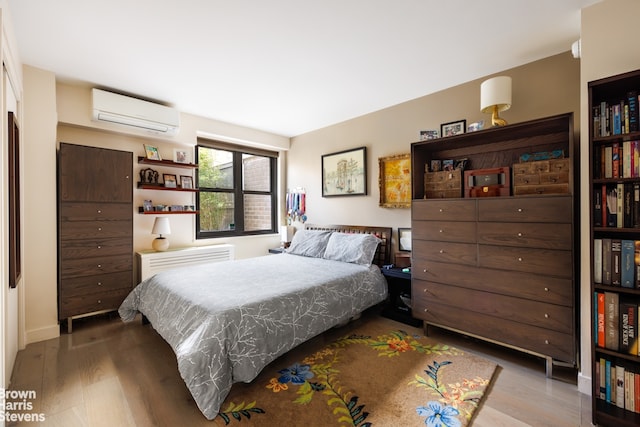 175 W 95th St Unit 2C, New York City, NY 10025 - bedroom featuring wood finished floors and a wall mounted AC