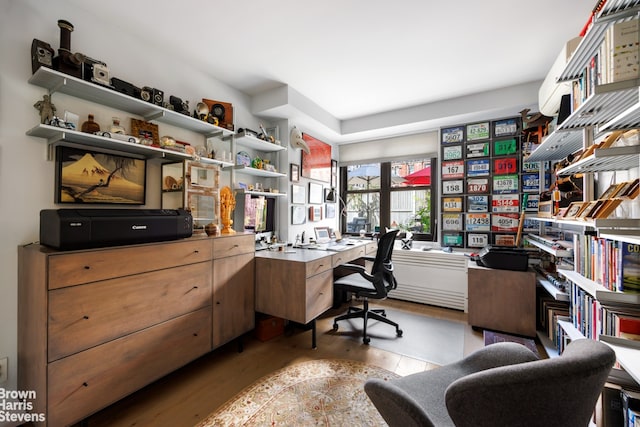 office space with light wood-type flooring