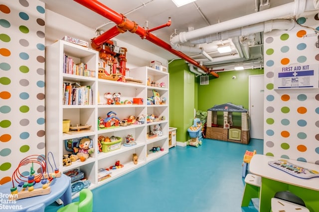 game room with concrete flooring