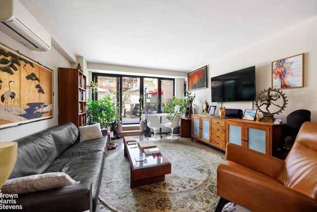 living room with an AC wall unit