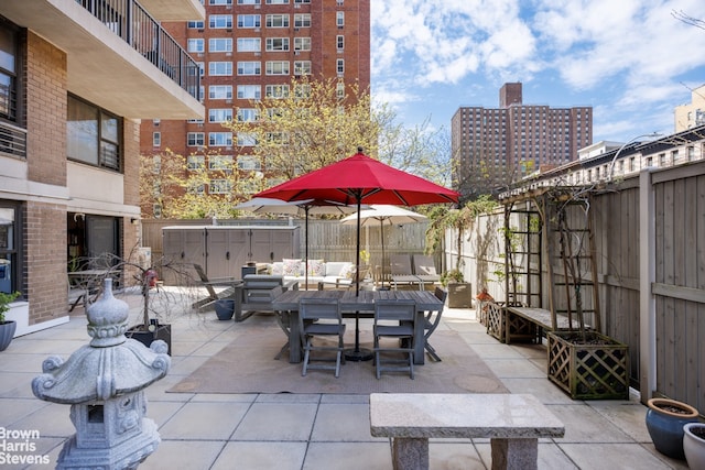 view of patio featuring a brick fireplace