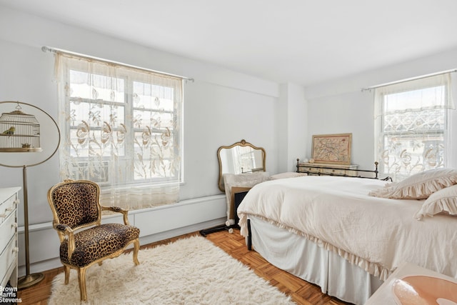 bedroom featuring multiple windows