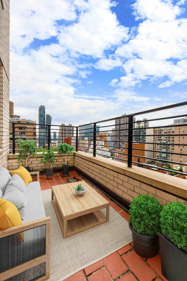 view of patio with an outdoor hangout area, a balcony, and a city view