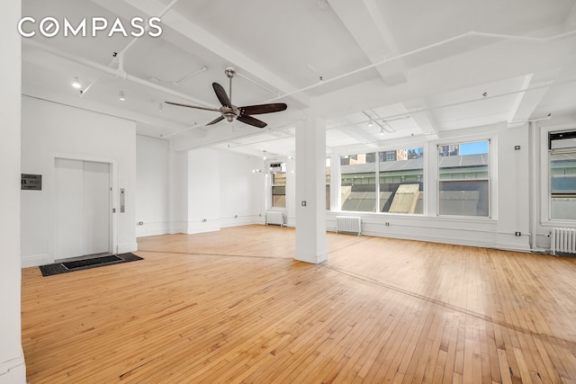 118 E 25th St Unit 8, New York City, NY 10010 - unfurnished living room with a ceiling fan and hardwood / wood-style flooring