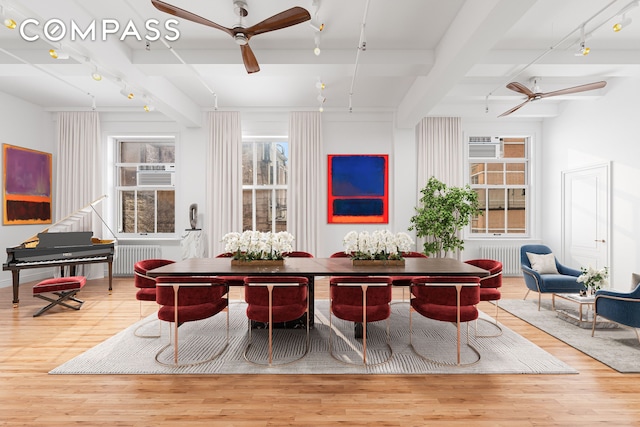 118 E 25th St Unit 8, New York City, NY 10010 - dining area featuring track lighting, ceiling fan, beamed ceiling, wood finished floors, and plenty of natural light
