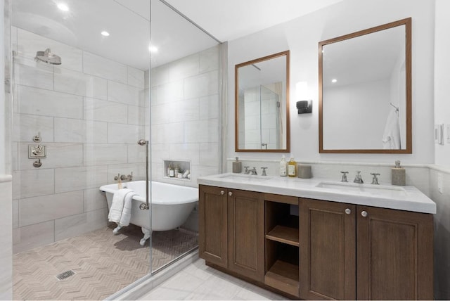 bathroom featuring tile walls, vanity, and independent shower and bath