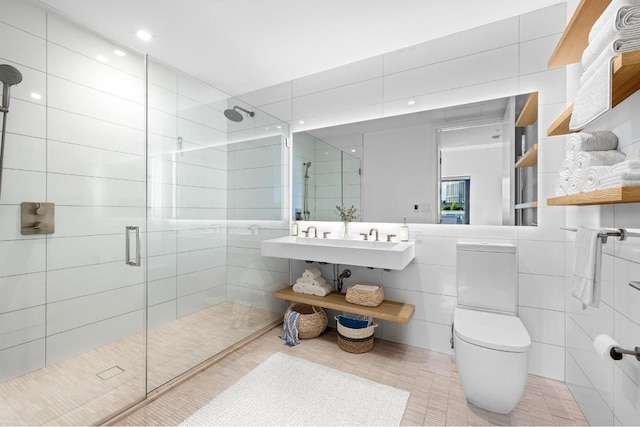 bathroom featuring tile walls, an enclosed shower, and toilet