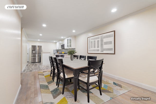 dining area featuring recessed lighting, visible vents, baseboards, ornamental molding, and light wood finished floors