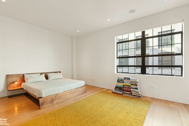 bedroom featuring recessed lighting and wood finished floors