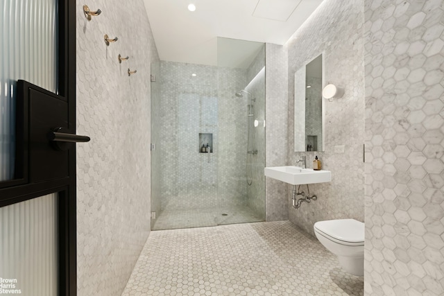 200 Water St Unit 3A, New York City, NY 11201 - full bathroom featuring tile patterned flooring, toilet, a shower stall, a sink, and tile walls