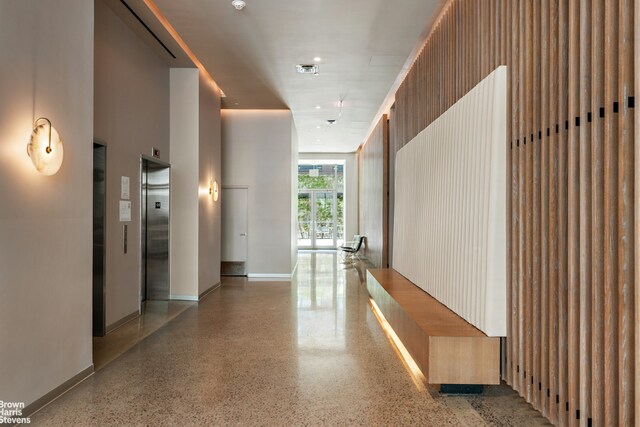 200 Water St Unit 3A, New York City, NY 11201 - hall with elevator, speckled floor, and baseboards