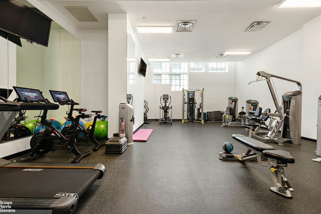 exercise room featuring visible vents