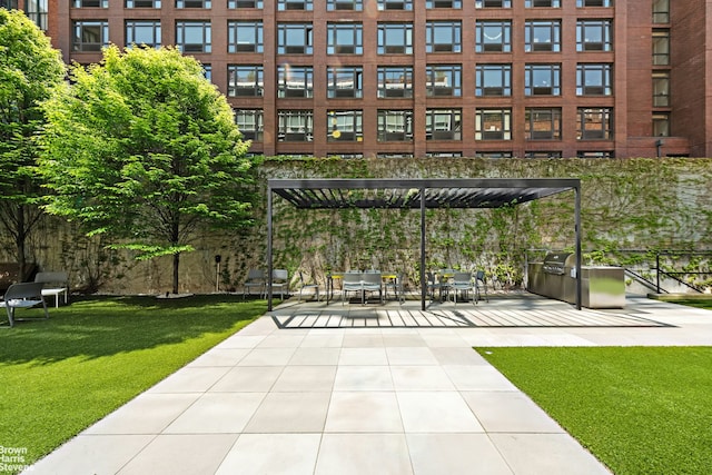 view of community featuring a patio, a pergola, and a yard