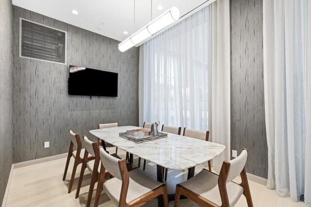 dining room featuring recessed lighting, light wood-type flooring, and wallpapered walls