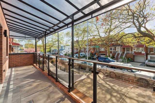 view of patio / terrace featuring a residential view and a balcony