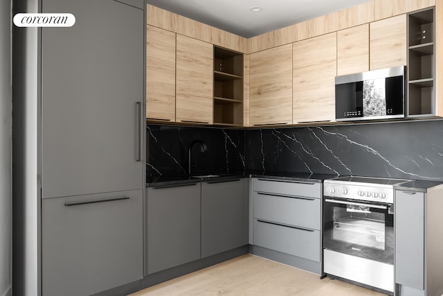 kitchen with backsplash, appliances with stainless steel finishes, modern cabinets, and open shelves