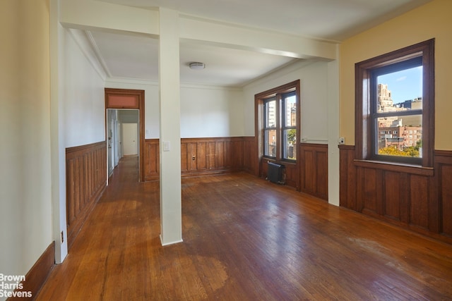 interior space with dark wood-type flooring and crown molding