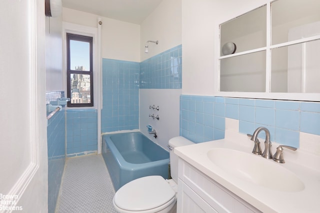 full bathroom featuring tile patterned flooring, vanity, shower / washtub combination, tile walls, and toilet