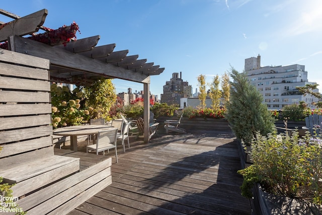 wooden terrace with a pergola