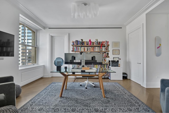 office featuring crown molding, baseboards, and wood finished floors