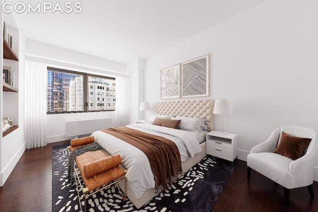 bedroom with dark hardwood / wood-style flooring and radiator heating unit