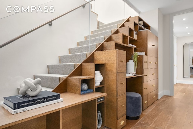 staircase featuring hardwood / wood-style flooring