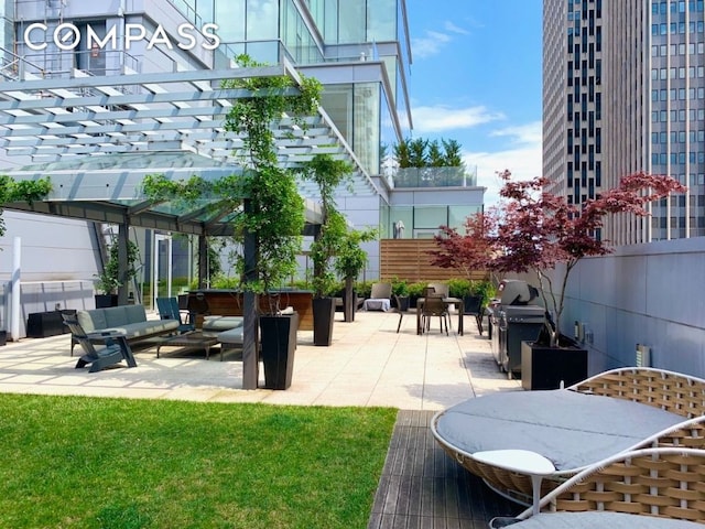 view of patio / terrace featuring a grill, outdoor lounge area, and a pergola