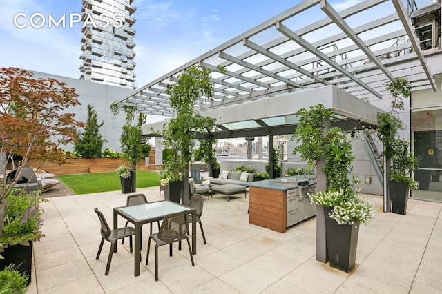 view of patio / terrace with area for grilling, an outdoor hangout area, and a pergola