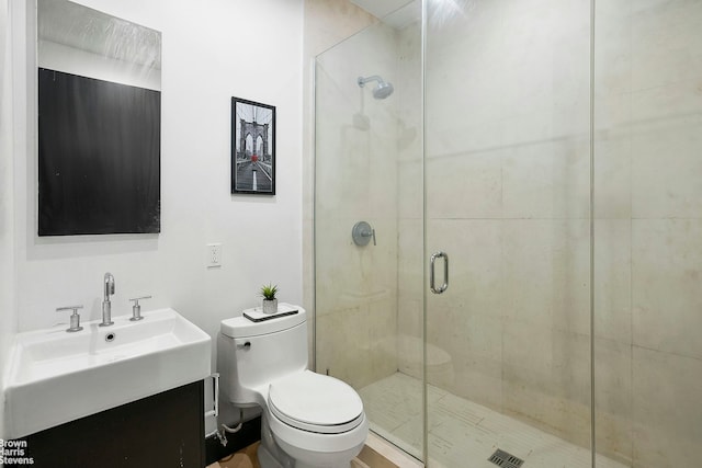 full bath with a shower stall, toilet, and vanity